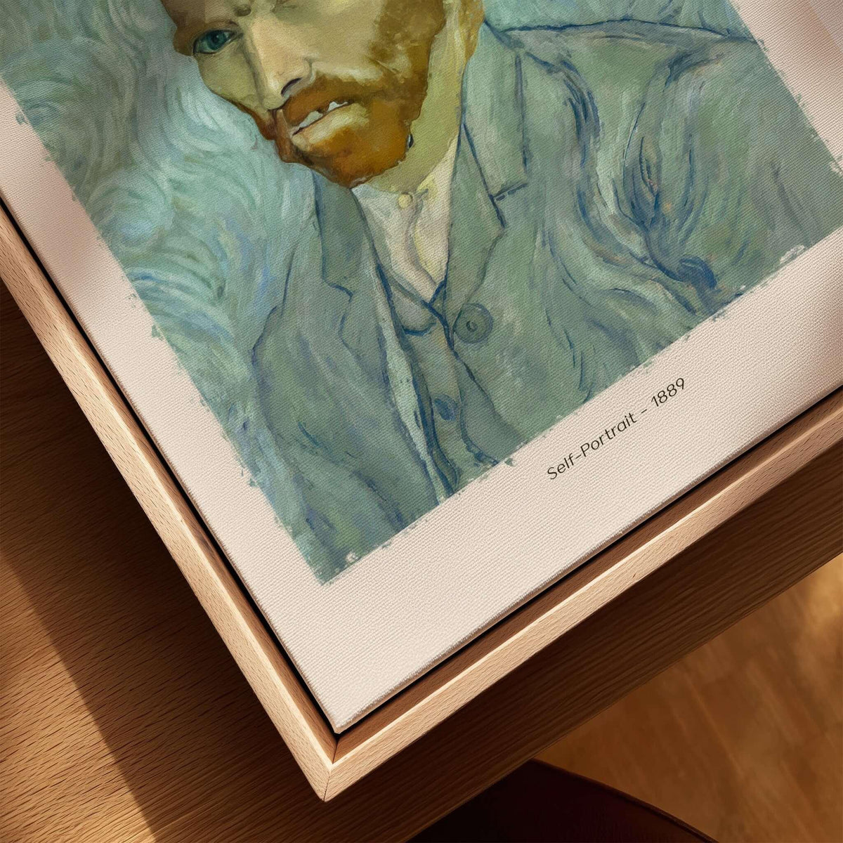 Vincent van Gogh Self Portrait 1889 Blue Post Impressionist Art Print Poster Wall Art displayed on a wooden surface.