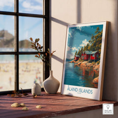 Åland Islands Lakeside Cabin Art Print | Finland Rustic Landscape Poster displayed in a cozy indoor setting.