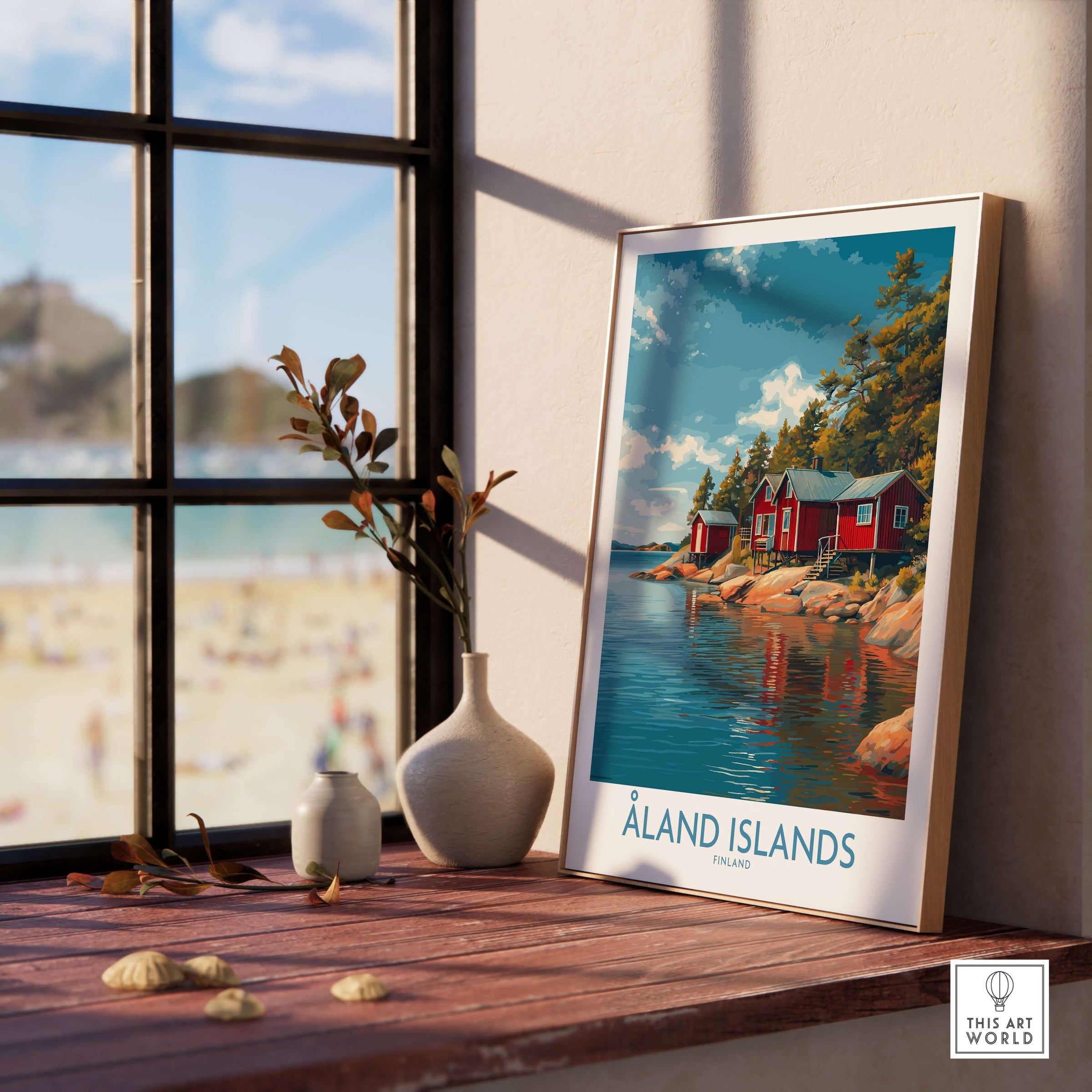 Åland Islands Lakeside Cabin Art Print | Finland Rustic Landscape Poster displayed in a cozy indoor setting.