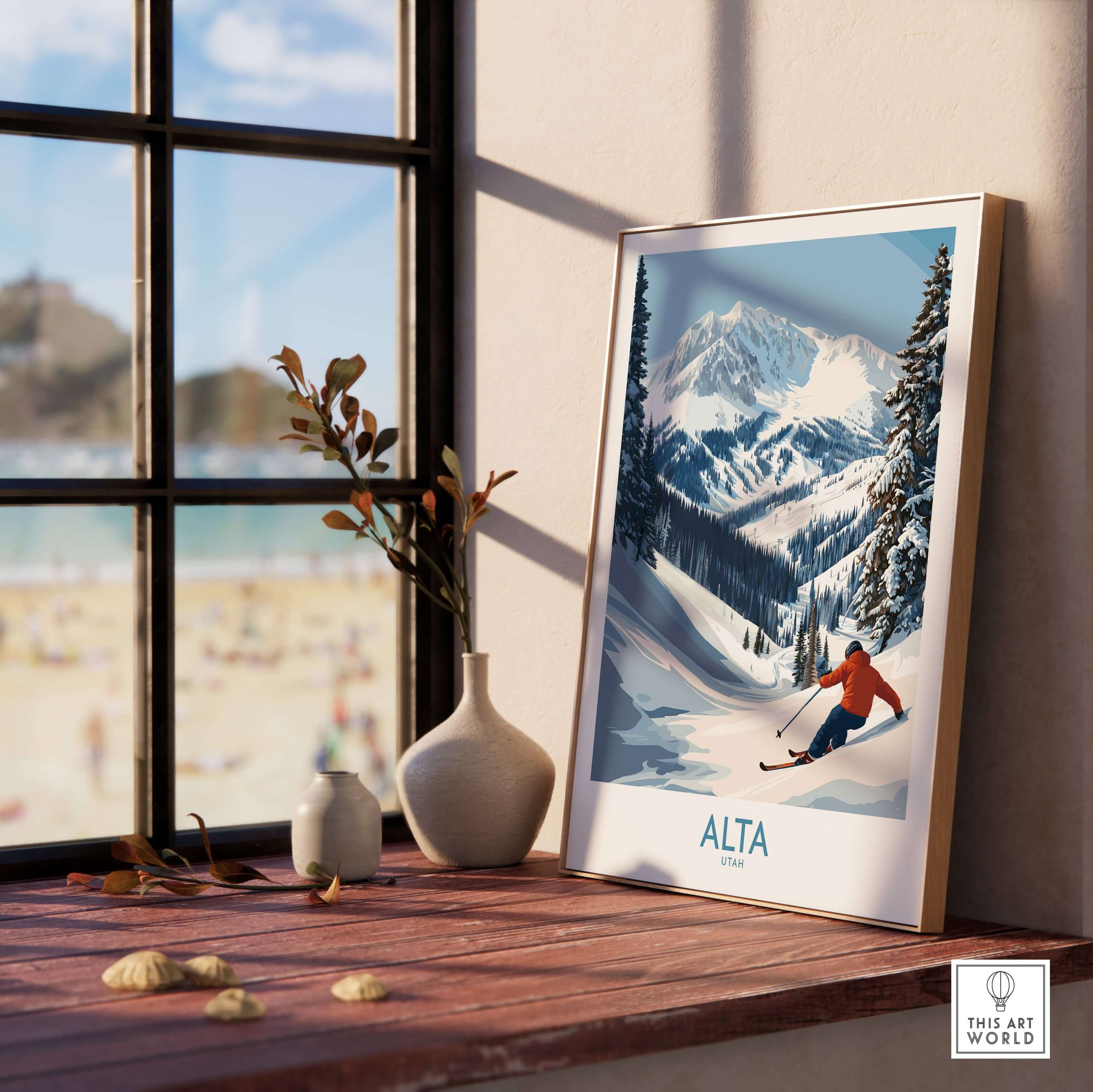 Alta Utah skiing adventure print on a wooden table with mountains visible through a large window.