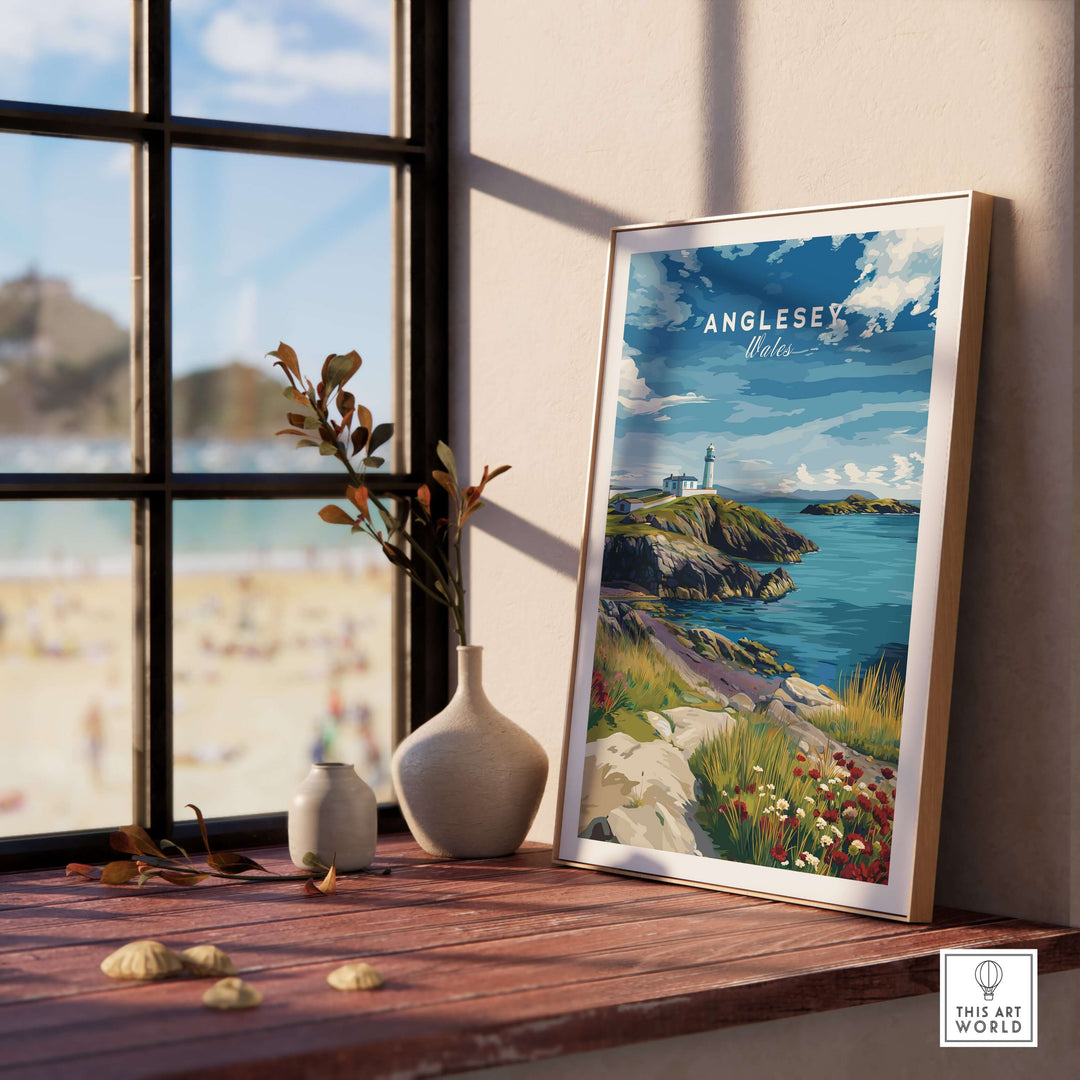 Anglesey Wales lighthouse poster on wooden table with coastal view, vibrant wall art showcasing wildflowers and sea.