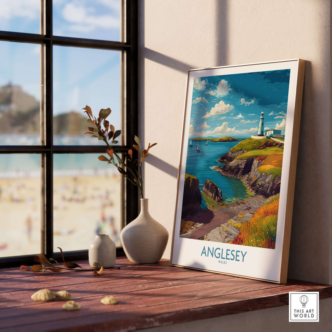 Anglesey Wales ocean view travel poster displayed by a window with seaside decor, showcasing coastal beauty and tranquility.