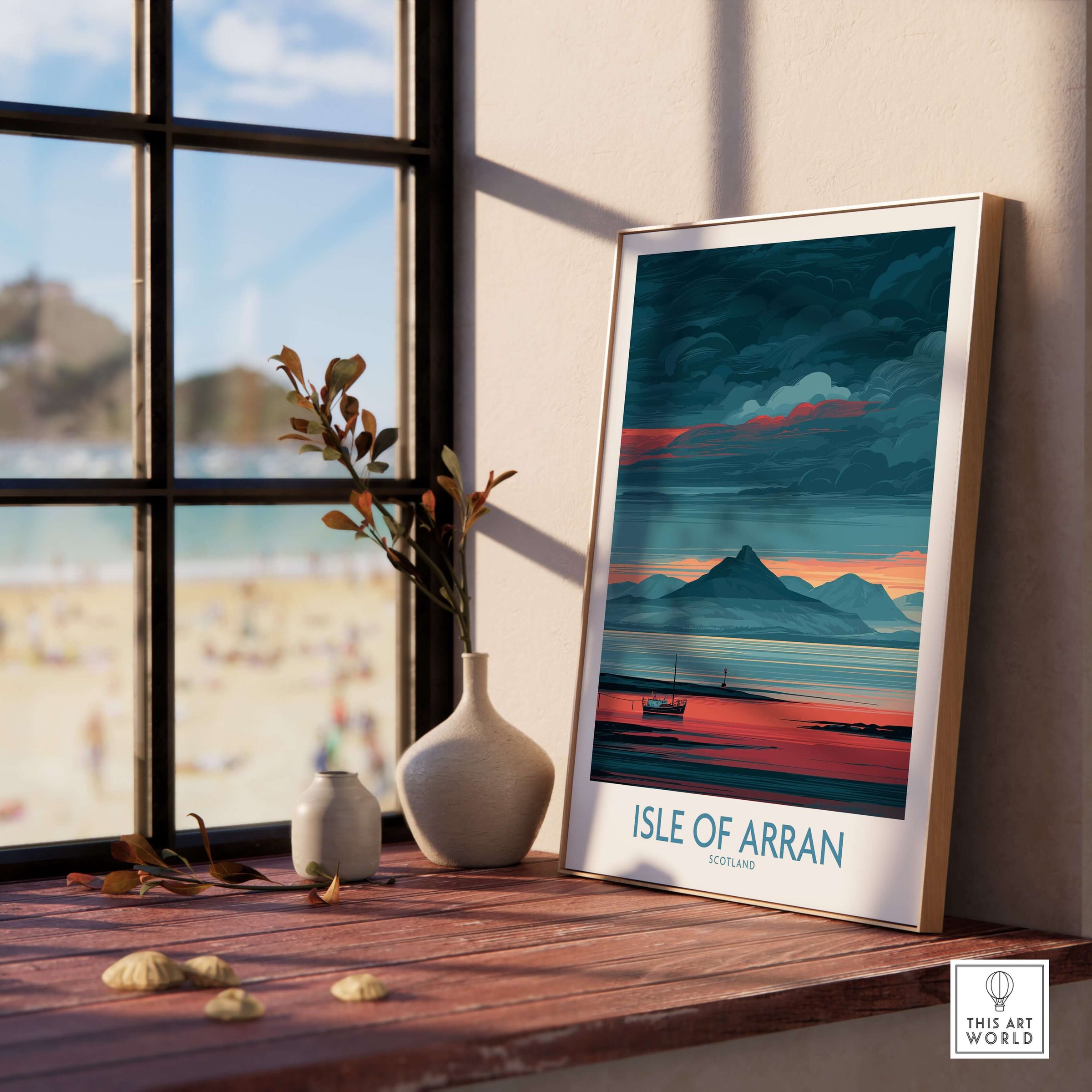Isle of Arran Poster Scotland Coastal Seascape - Isle of Arran Travel Print displayed on a wooden shelf by a window.