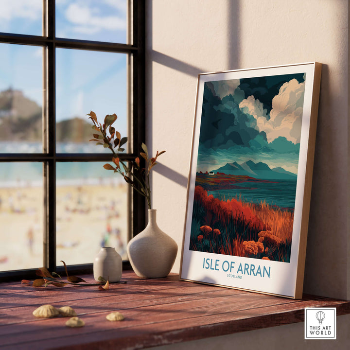 Isle of Arran Scotland poster with stormy landscape displayed indoors, capturing dramatic natural beauty.