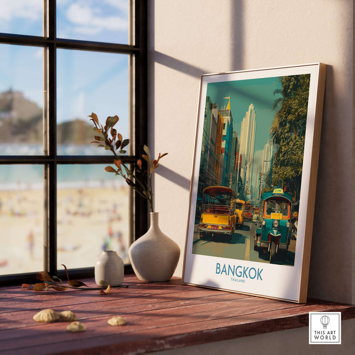 Bangkok travel print featuring vibrant street life and tuk tuks, framed by a window in a cozy setting.