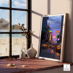 Bangkok Thailand Print Night Market Street -Thai Cityscape Poster displayed in a cozy interior setting with beach view.