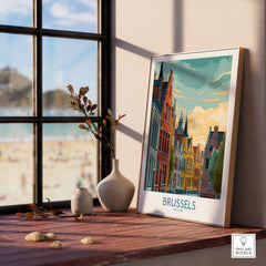 Brussels Belgium Travel Poster displayed on a wooden table near a window, showcasing vibrant architecture and scenery.