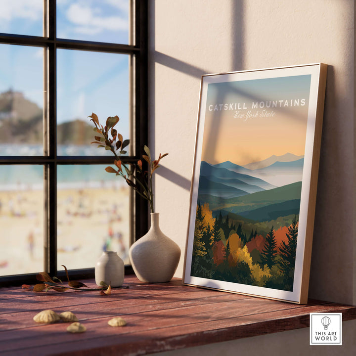Catskill Mountains New York Autumn Foliage print framed on a windowsill, showcasing vibrant fall colors in a serene landscape.