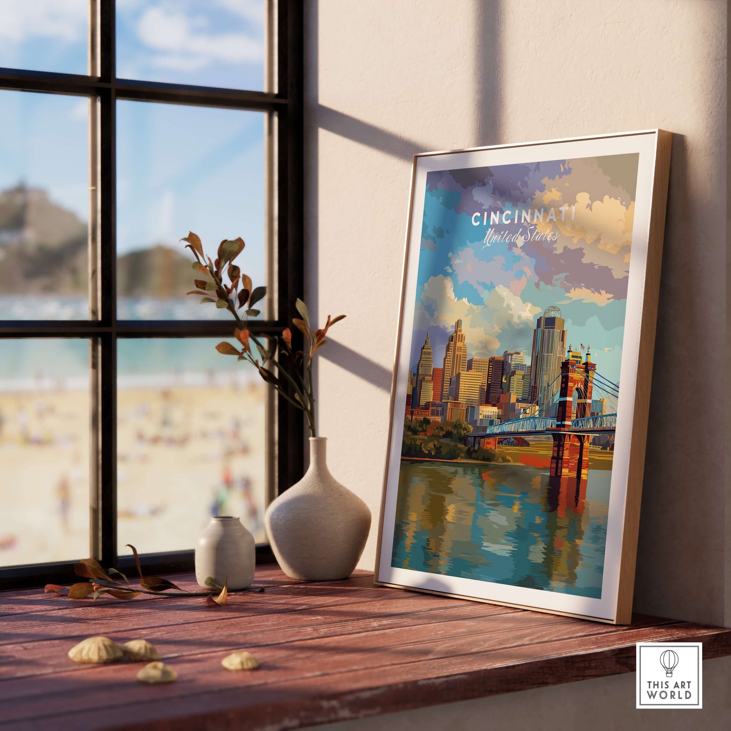 Cincinnati Ohio Skyline Print - Roebling Bridge Wall Art displayed in a cozy room setting with a beach view.