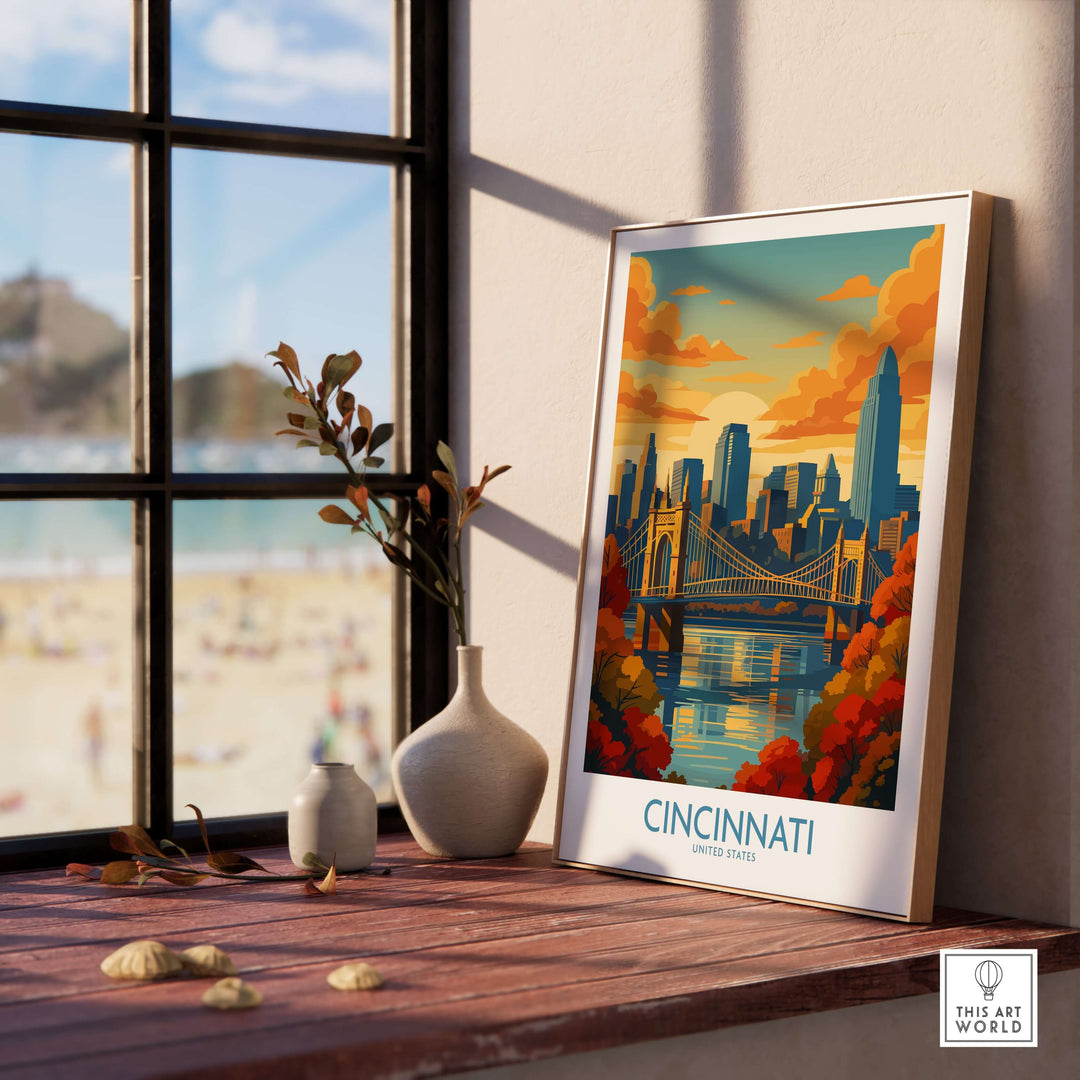 Cincinnati skyline print showcasing autumn colors and cityscape decor on a wooden table by a sunny window.