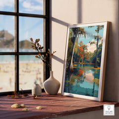 De Leon Springs Poster - Serene Florida State Park Wall Art displayed on a wooden table beside a window.