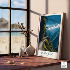 Death Road Bolivia Mountain Art Print | Yungas Camino Poster framed on a windowsill with a scenic view of the mountains.