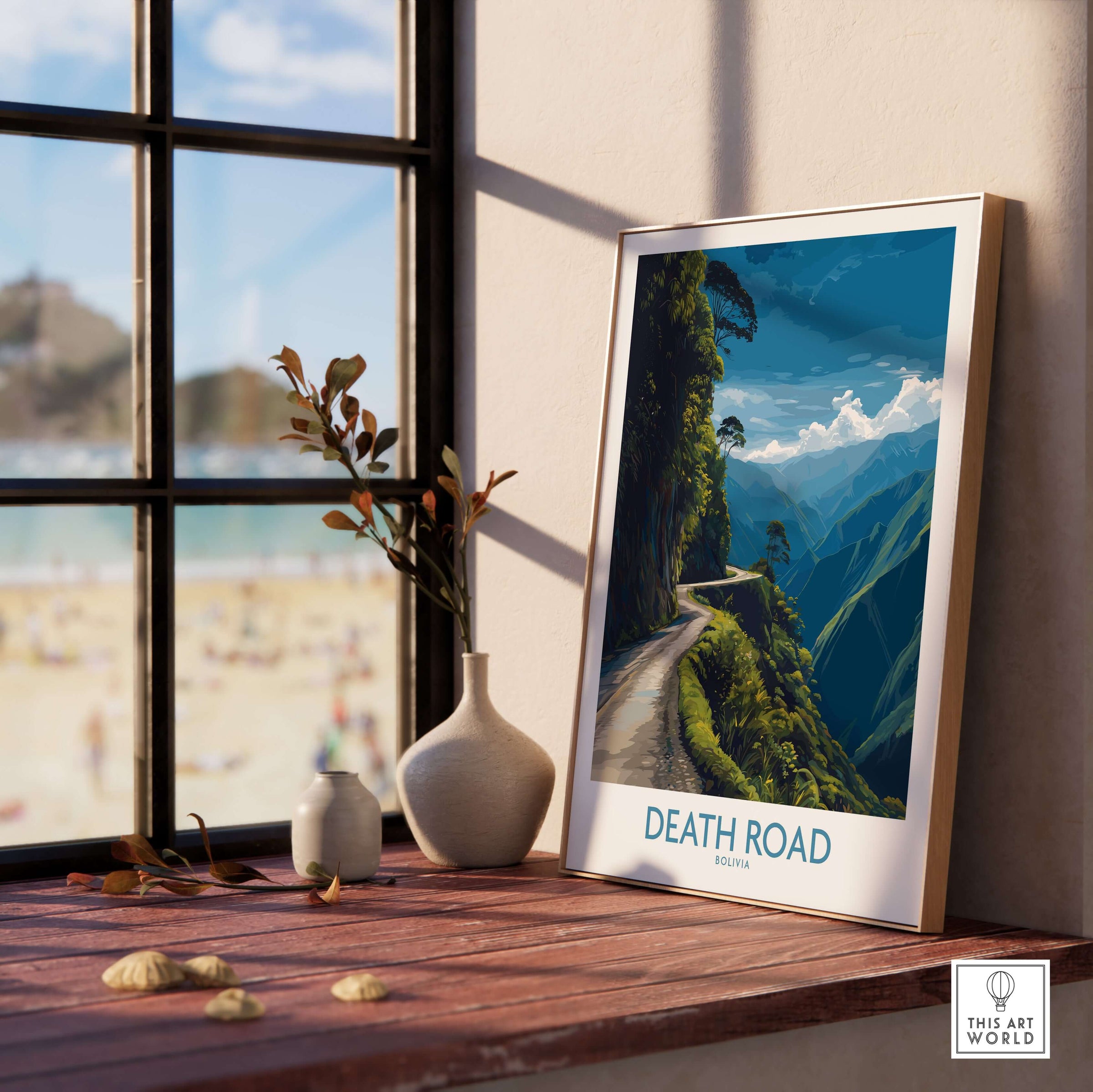 Death Road Bolivia Mountain Art Print | Yungas Camino Poster framed on a windowsill with a scenic view of the mountains.