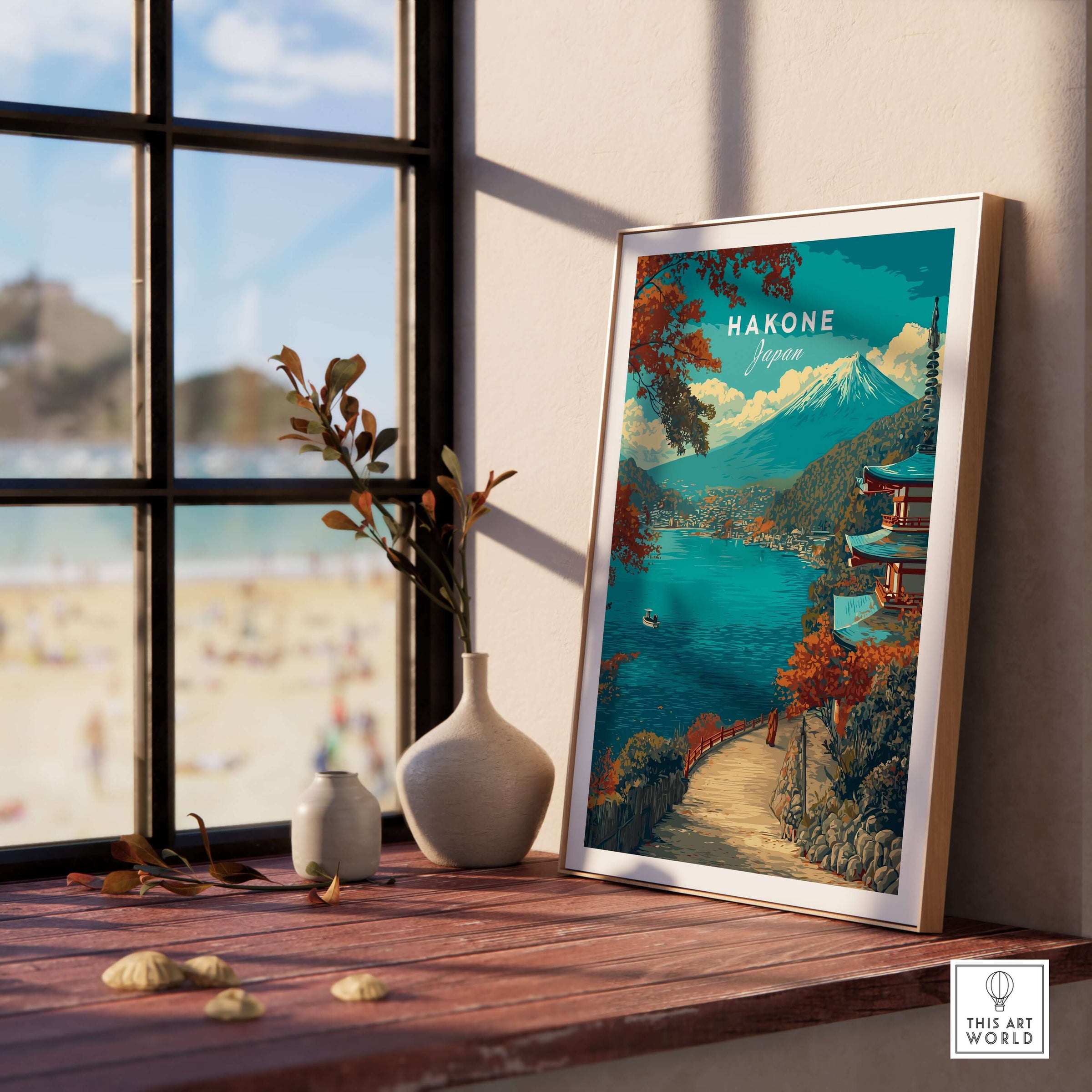 Hakone Print Japan Lake View Pagoda - Mount Fuji Scenic Poster displayed on a wooden table by a sunny window.