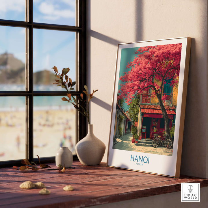 Hanoi Vietnam poster featuring historic architecture and pink trees, adding vibrant decor to a cozy setting.