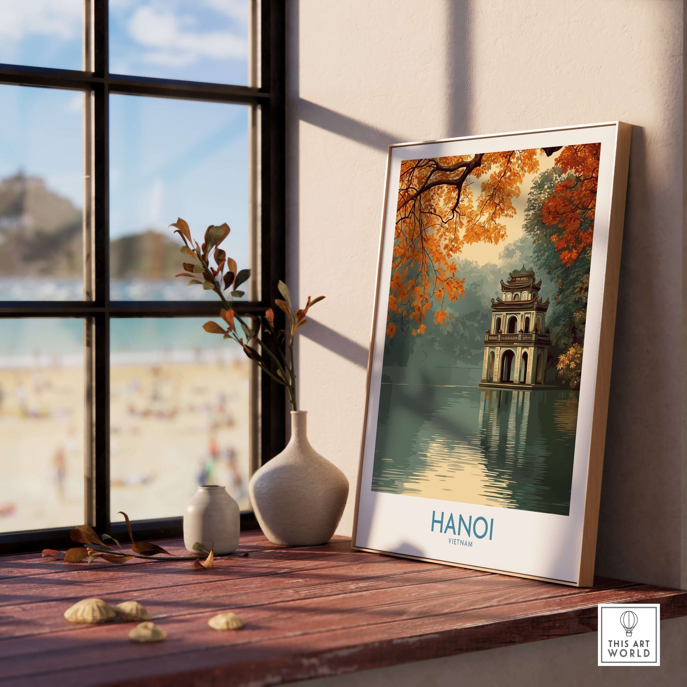 Hanoi Vietnam Turtle Tower Wall Art - Iconic Hanoi Landmark Decor displayed on a wooden table near a window.