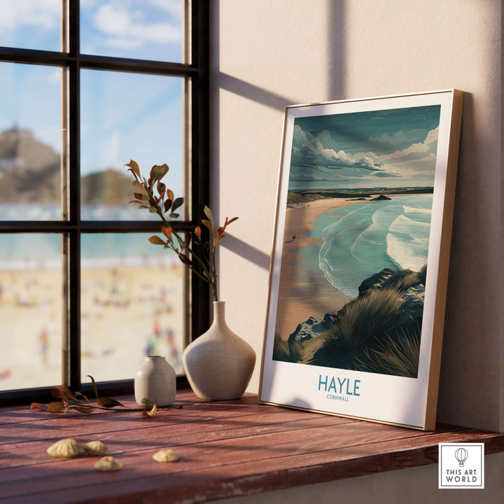 Hayle Sandy Beach poster displayed by a window, showcasing Cornwall's serene coastal beauty and inviting beach vibes.
