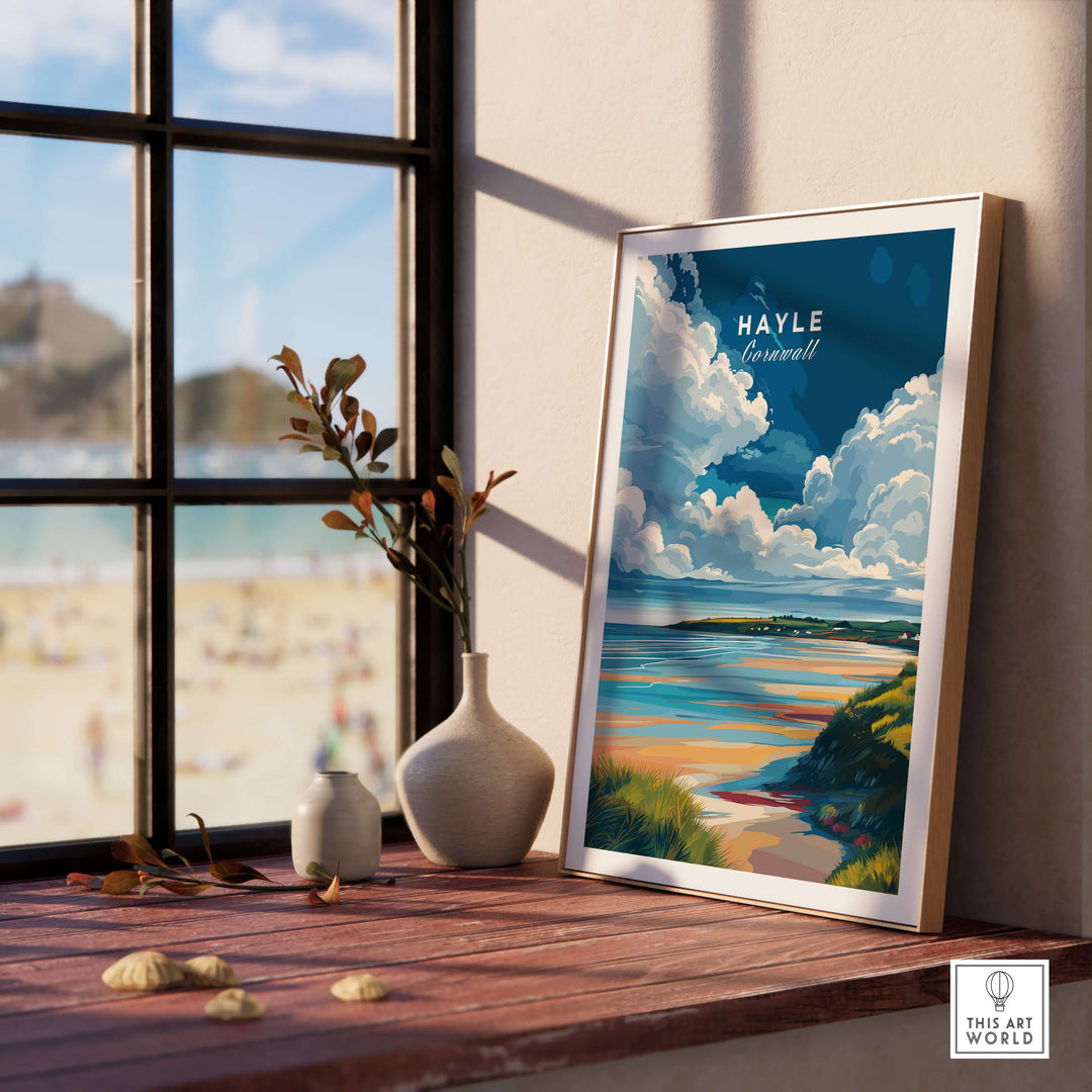 Hayle Ocean View print showcasing Cornwall's coastline, framed on a wooden shelf with a beach view outside.