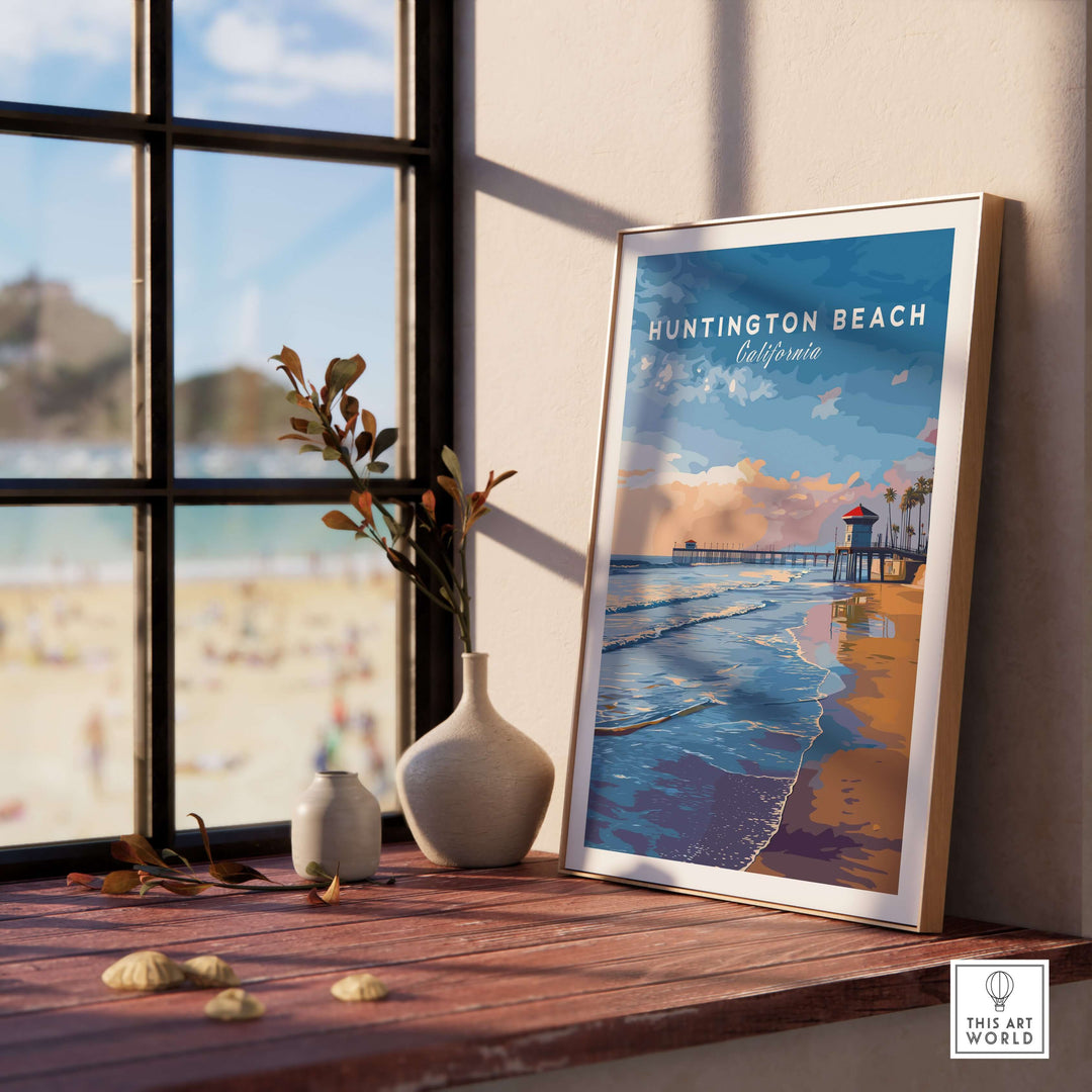 Huntington Beach Pier sunset poster on display by a sunny window, showcasing coastal California wall art.