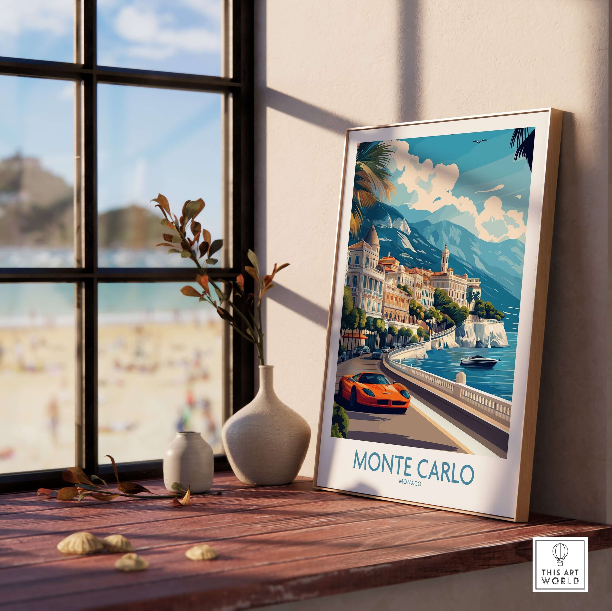 Monte Carlo Wall Art Monaco Travel Poster displayed on a wooden table by a window with a view of the beach.