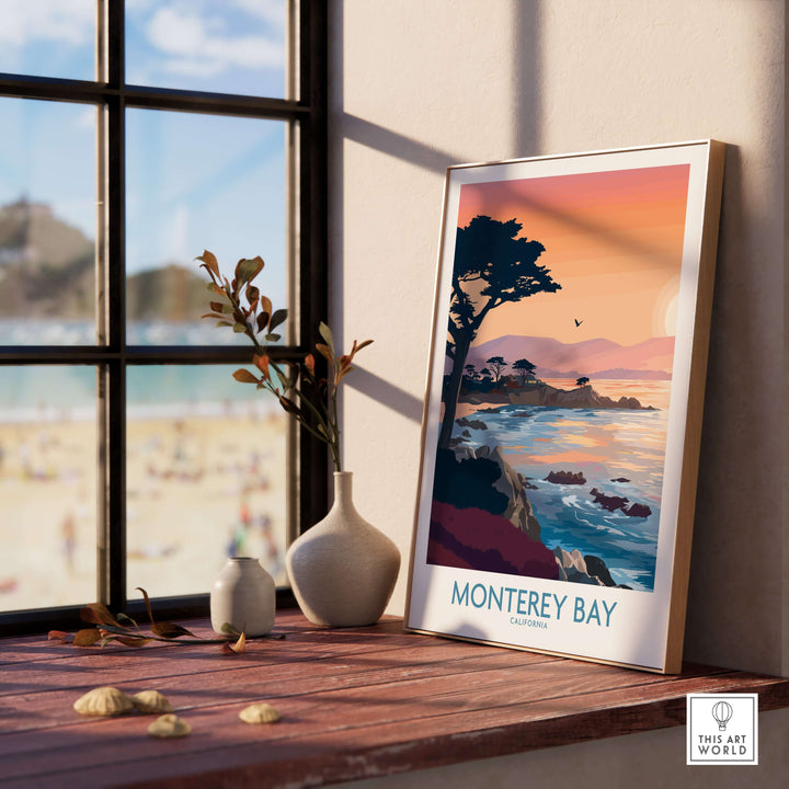 Monterey Bay California sunset coastline poster featuring cypress trees, displayed by a sunny window.