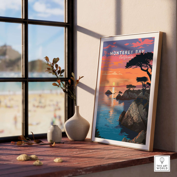 Monterey Bay California print displayed on a sunny windowsill, showcasing scenic coastline and tranquil seaside views.