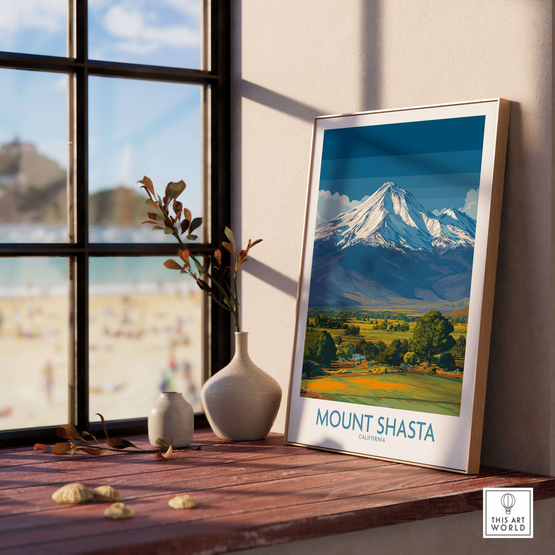Mount Shasta California poster displayed on a wooden table near a window, showcasing the mountain's majestic beauty.