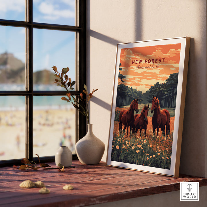 "New Forest Print poster on windowsill, featuring horses and nature scene, captures essence of UK National Park, perfect for home decor."