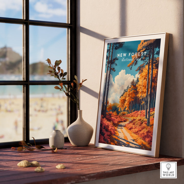 New Forest travel poster in frame, depicting vibrant autumn landscape, displayed on a windowsill, enhancing room decor.