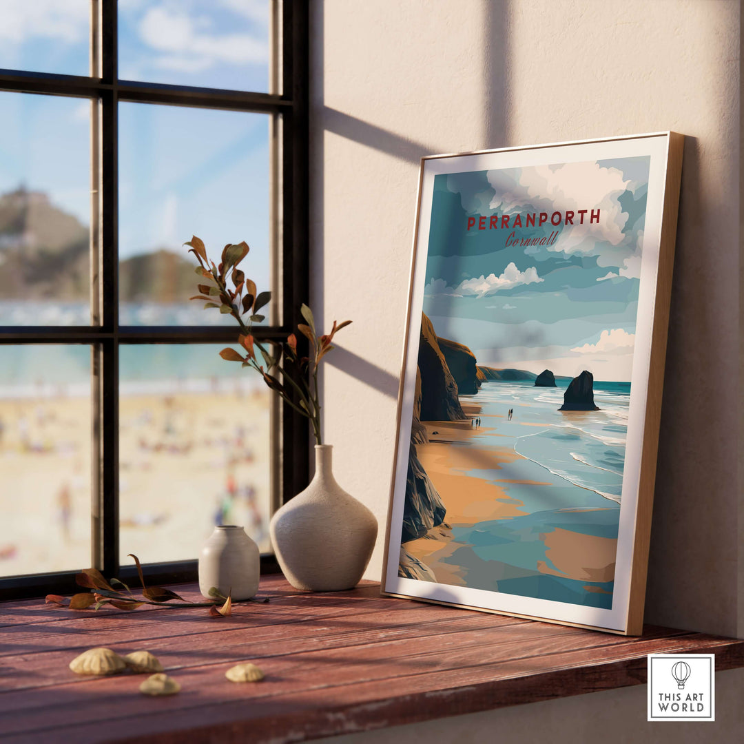 Perranporth low tide beach poster framed on a wooden table by a window showcasing the Cornish coast.