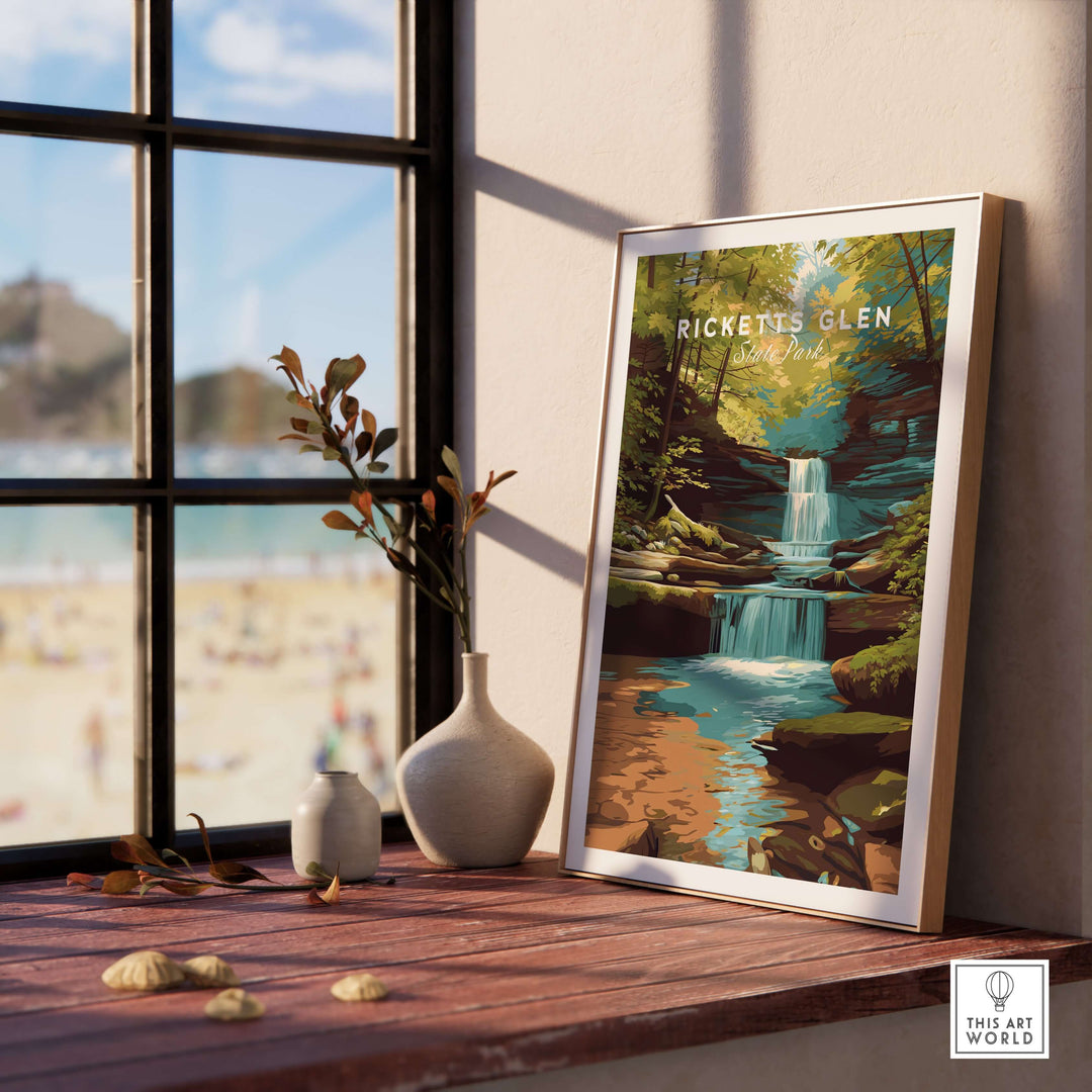 Framed Ricketts Glen waterfall landscape print on a windowsill, showcasing serene nature and state park beauty.