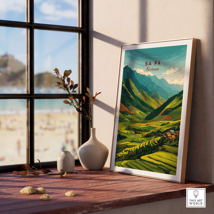 Sa Pa Vietnam poster showcasing vibrant green rice terraces and mountains, displayed on a windowsill with a beach view.