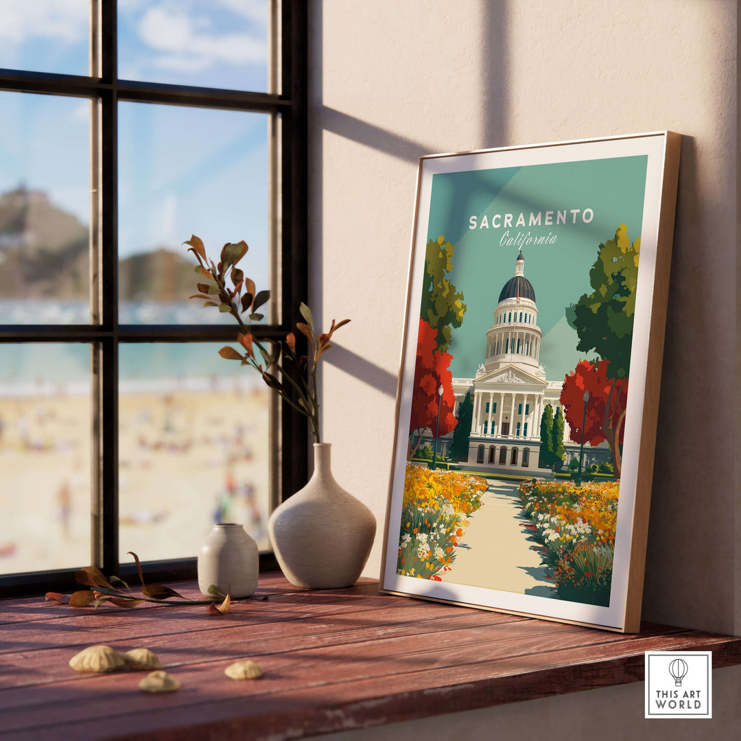 Sacramento California State Capitol Building art print displayed on a windowsill with a view of the beach.