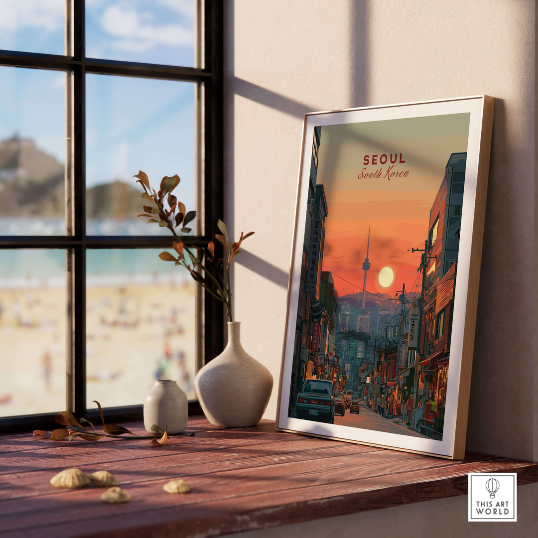 Framed N Seoul Tower sunset print on a windowsill, showcasing Seoul's skyline and urban charm.