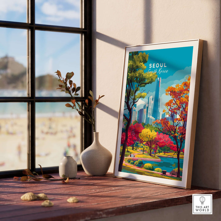 Framed print of Lotte World Tower in Seoul, showcasing colorful trees and city skyline near a sunny beach.