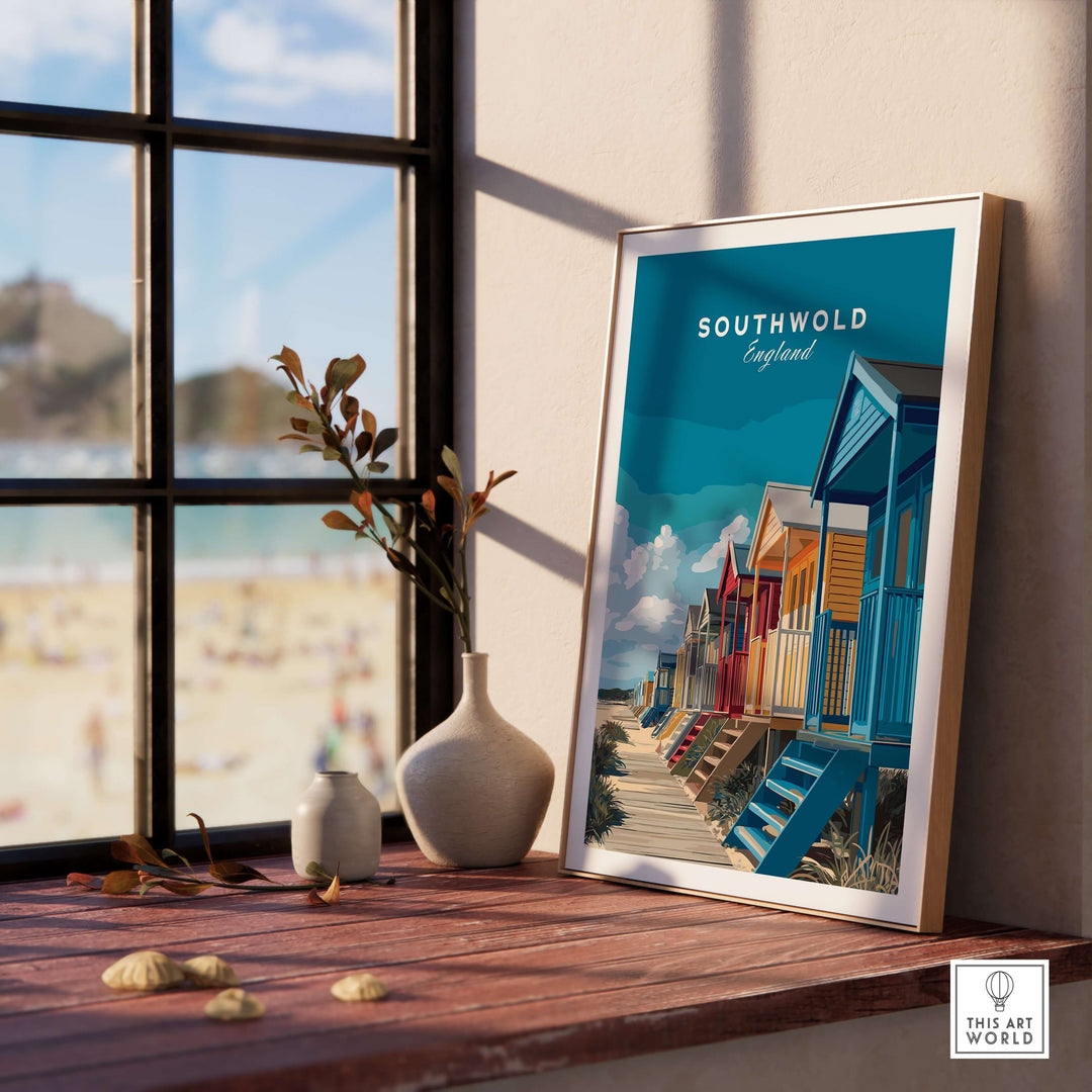 Vibrant Southwold England beach huts print displayed in a cozy room, capturing seaside charm and color.