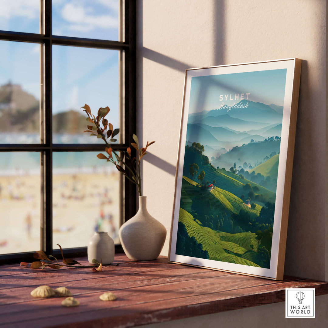 Sylhet Bangladesh tea fields print in a stylish frame on a wooden table with a scenic view outside.