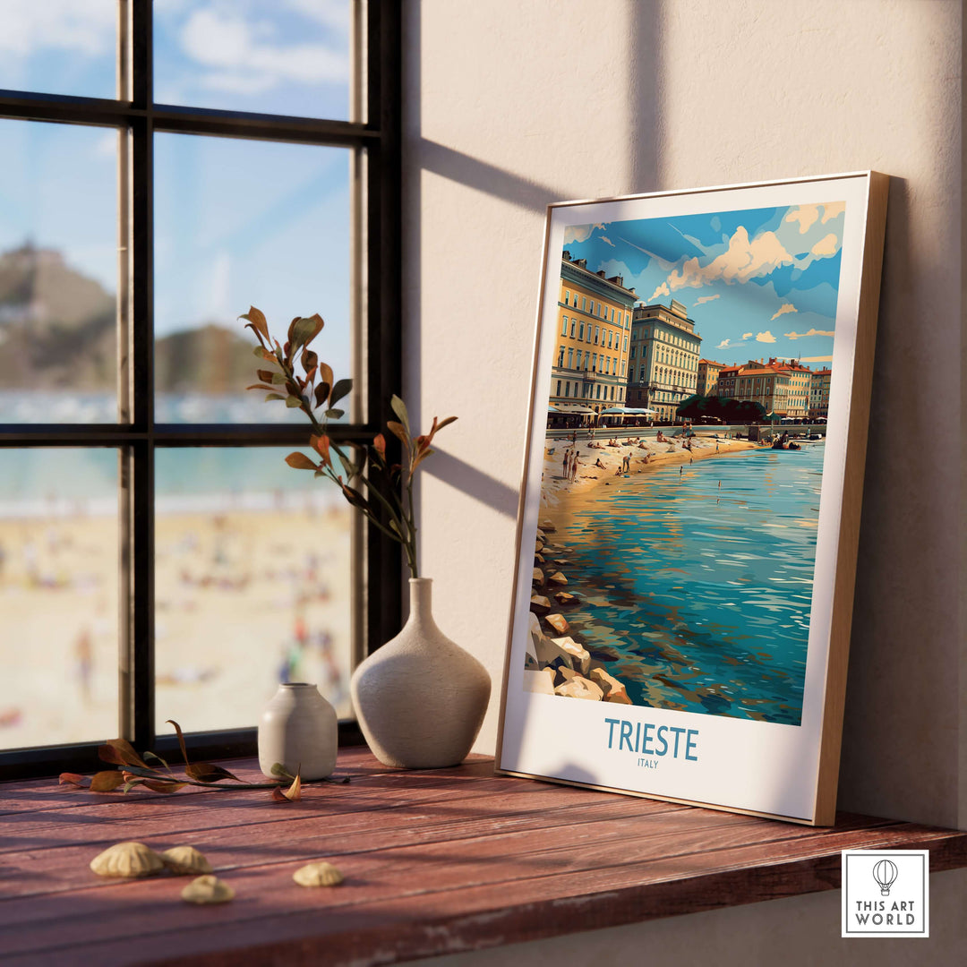 Framed Trieste Italy travel poster showcasing coastal beauty and historic charm by a sunlit window.