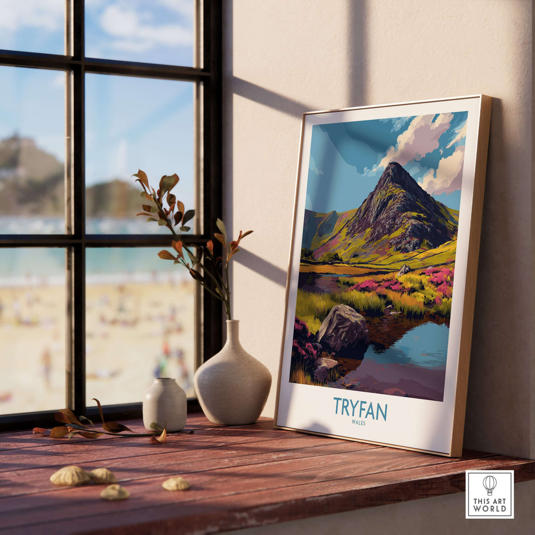 Tryfan Wales Heather Fields Peak Poster displayed on a wooden shelf, showcasing vibrant Welsh landscapes and rugged peaks.
