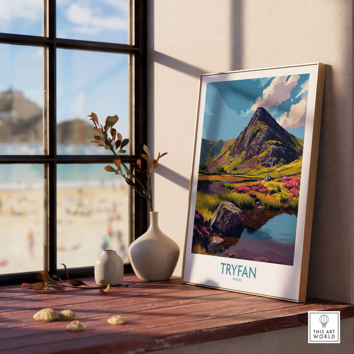Tryfan Wales Heather Fields Peak Poster displayed on a wooden shelf, showcasing vibrant Welsh landscapes and rugged peaks.