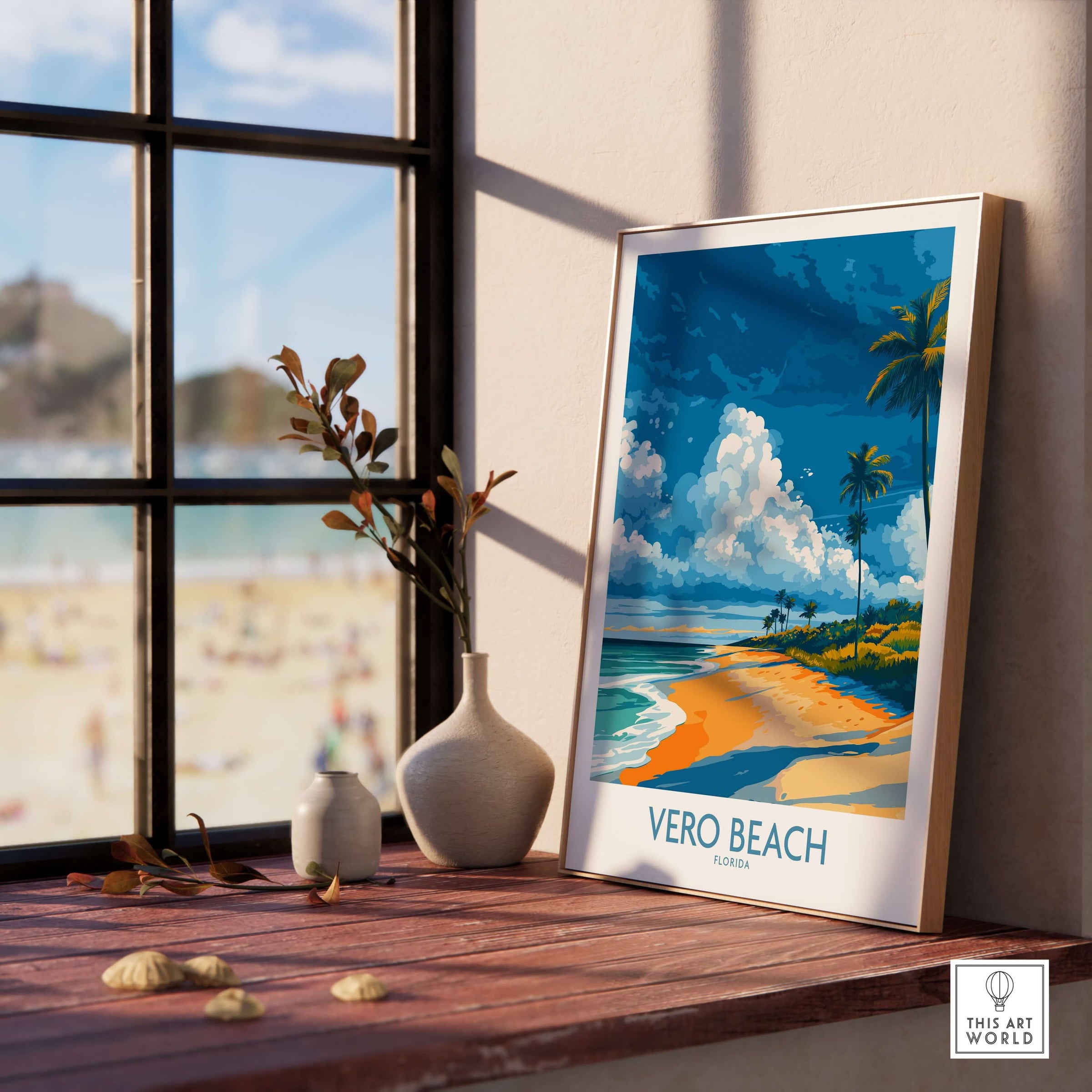 Vero Beach Sunny Coastal Landscape Print - Florida Travel Decor displayed on a windowsill with beach view in background.