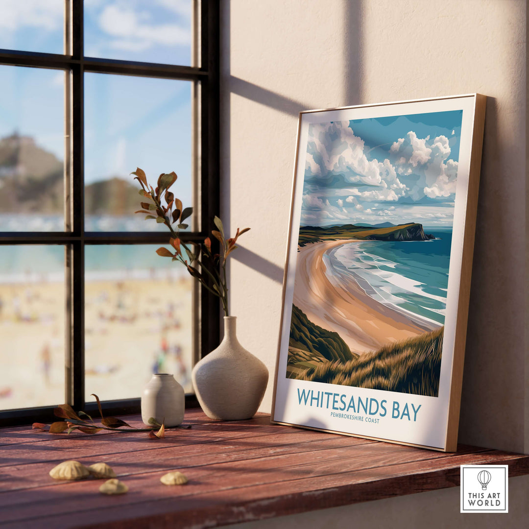Whitesands Bay Pembrokeshire poster displayed indoors with coastal view and decorative plants.