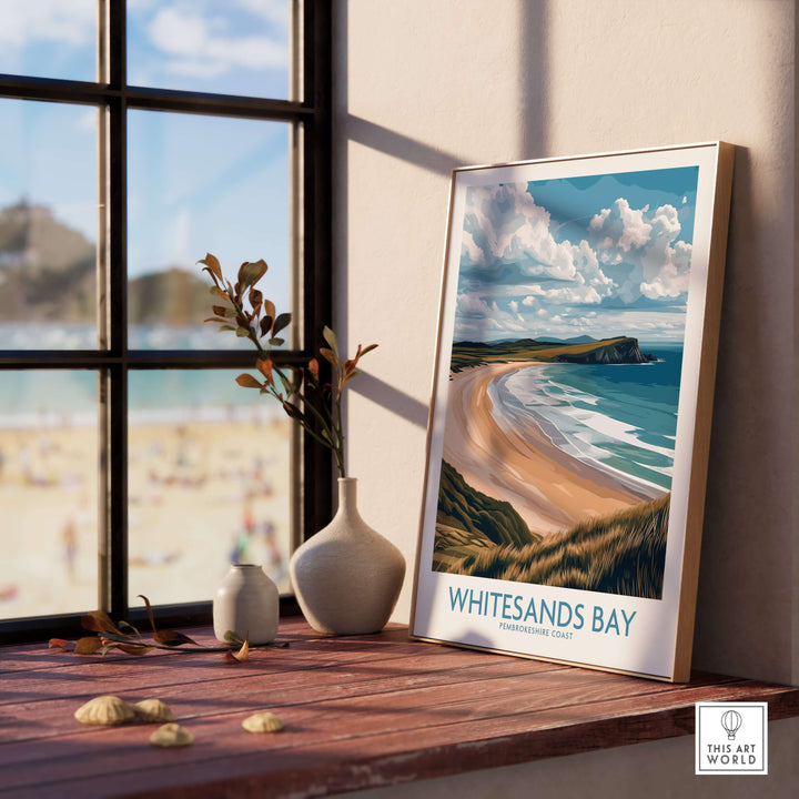 Whitesands Bay Pembrokeshire poster displayed indoors with coastal view and decorative plants.