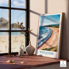 Woolacombe Devon Coastal Cliffs Wall Art - UK Travel Destination Decor displayed in a bright room by the window.