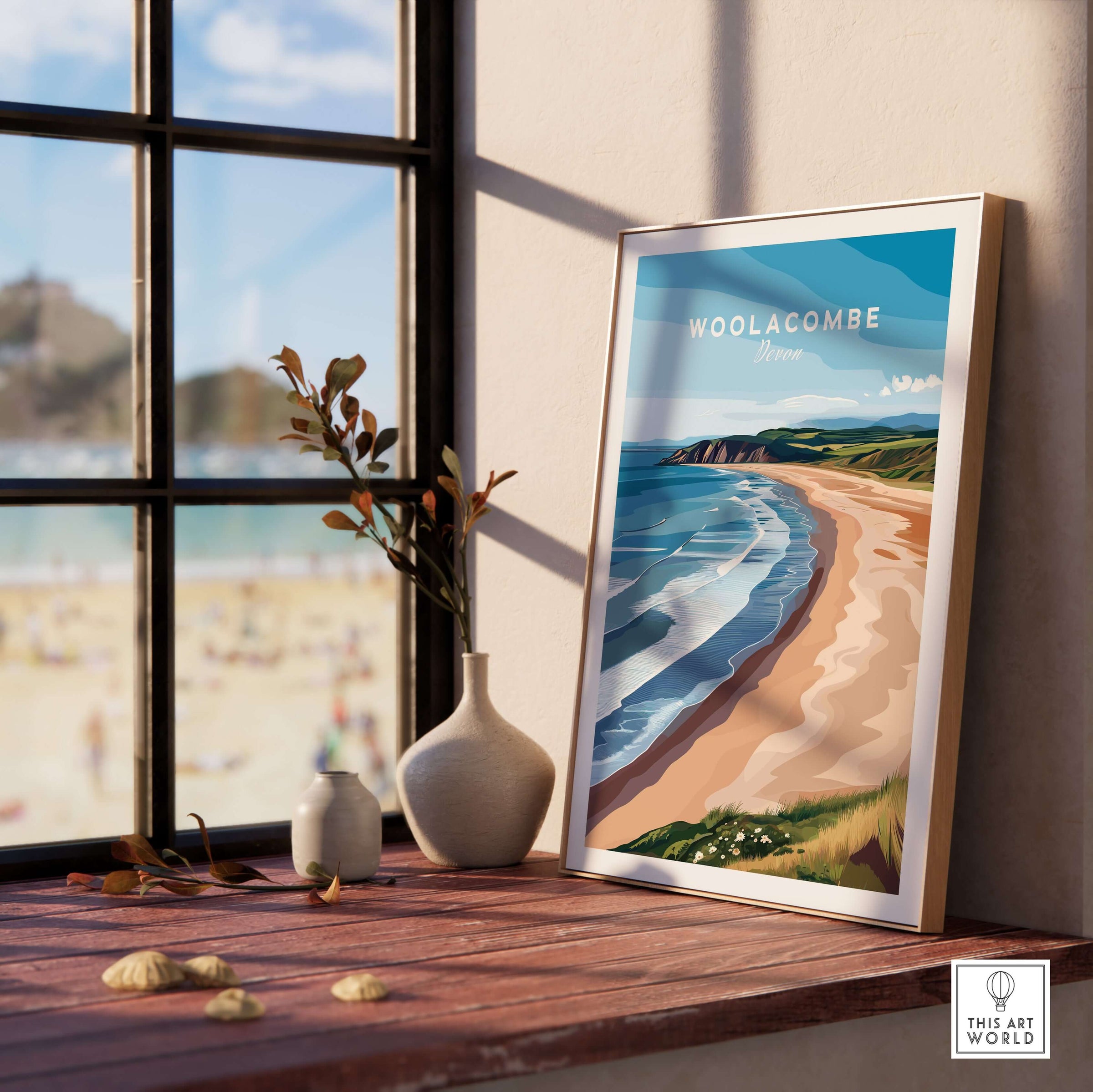 Woolacombe Devon Long Beach Sunset Poster - Rolling Waves Print displayed on a wooden table by a window.
