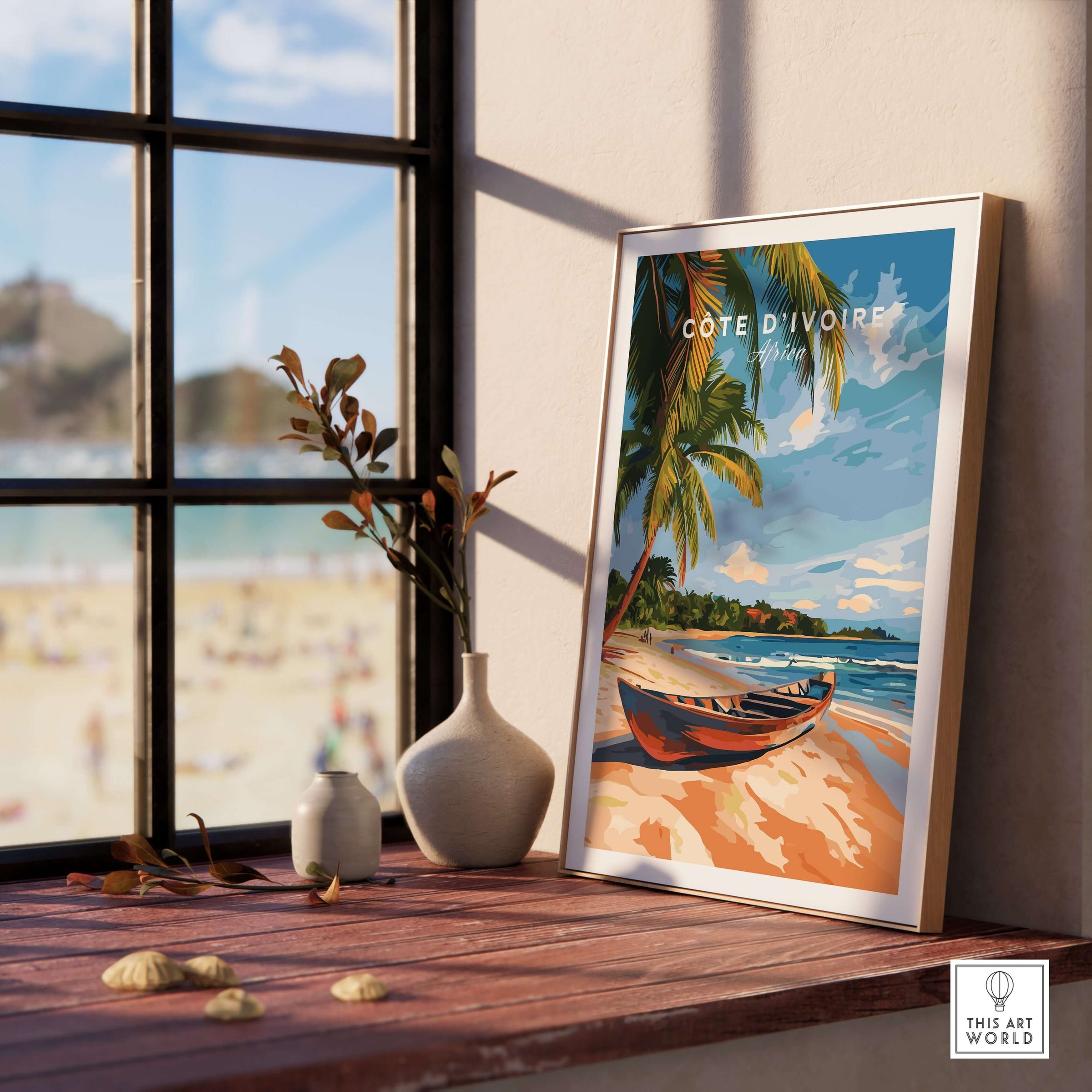 Côte d'Ivoire Beach Wall Art in a serene indoor setting with ocean view and decorative elements.