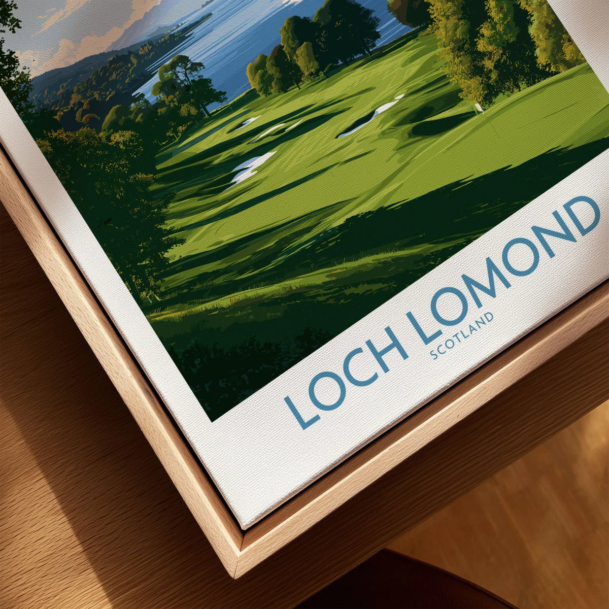 Loch Lomond Scotland Lochside Meadow Wall Art — a sunlit grassy shoreline running down to Loch Lomond under old oaks, shown as closeup framed canvas natural wood floating frame
