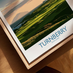 Turnberry Scotland Ayrshire Dusk Wall Art — Ailsa Craig and the white lighthouse across rolling coastal turf at dusk, shown as closeup framed canvas natural wood floating frame