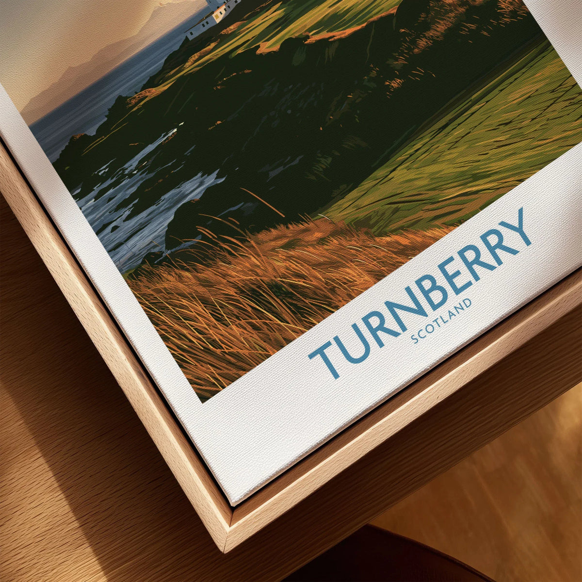Turnberry Scotland Rocky Shore Wall Art — the Turnberry lighthouse above a rocky shore with the Arran hills beyond, shown as closeup framed canvas natural wood floating frame