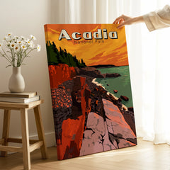 Acadia National Park travel poster canvas print with rocky coast, hand holding it in cozy room